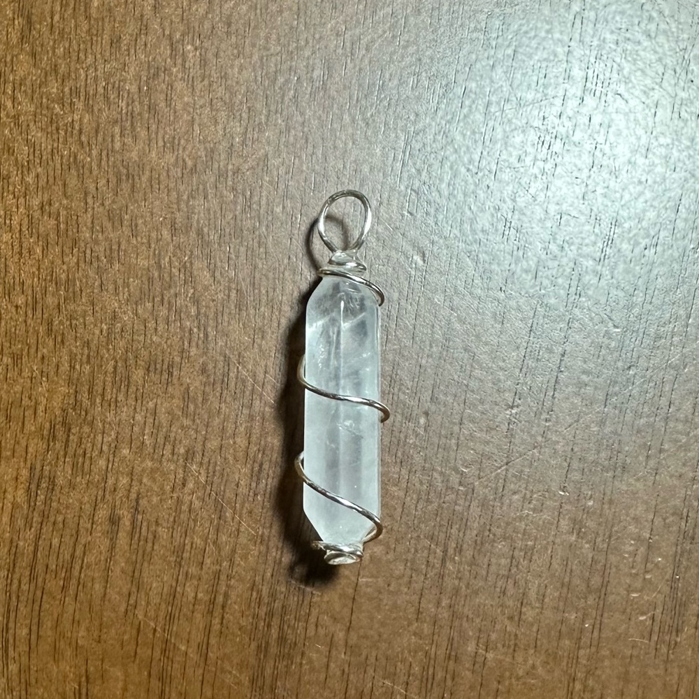 Clear Quartz Crystal Point Hand Wrapped in 925 Sterling Silver Wire..